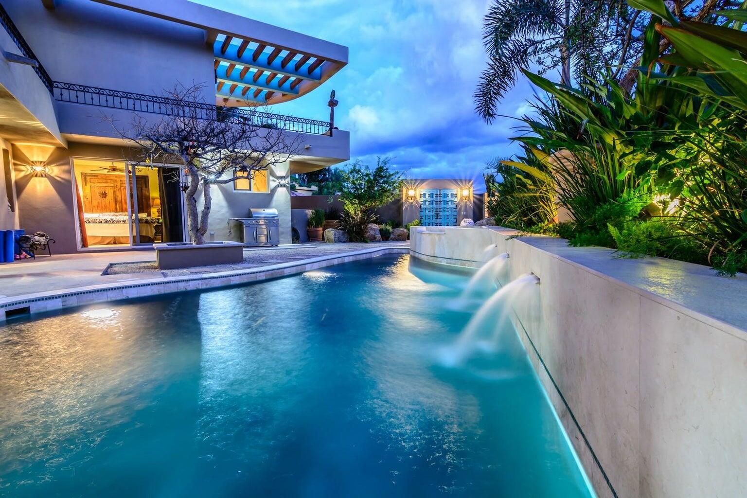 Cabo San Lucas Pedregal Csl Tucked into the lush mountains of Pedregal, this residence offers rare privacy, land value, and untapped potential. Its standout feature is the expansive green zone beside the pool--a true rarity in Pedregal, where landscaping and usable outdoor space significantly elevate long-term value. This alone positions the property as a compelling investment. The home includes four bedrooms with lock-out closets, two separate entrances, a chef's kitchen with GE Monogram appliances and an aqua granite island, plus essentials like a generator and storm shutters. Ocean, hillside, and lush garden for sale