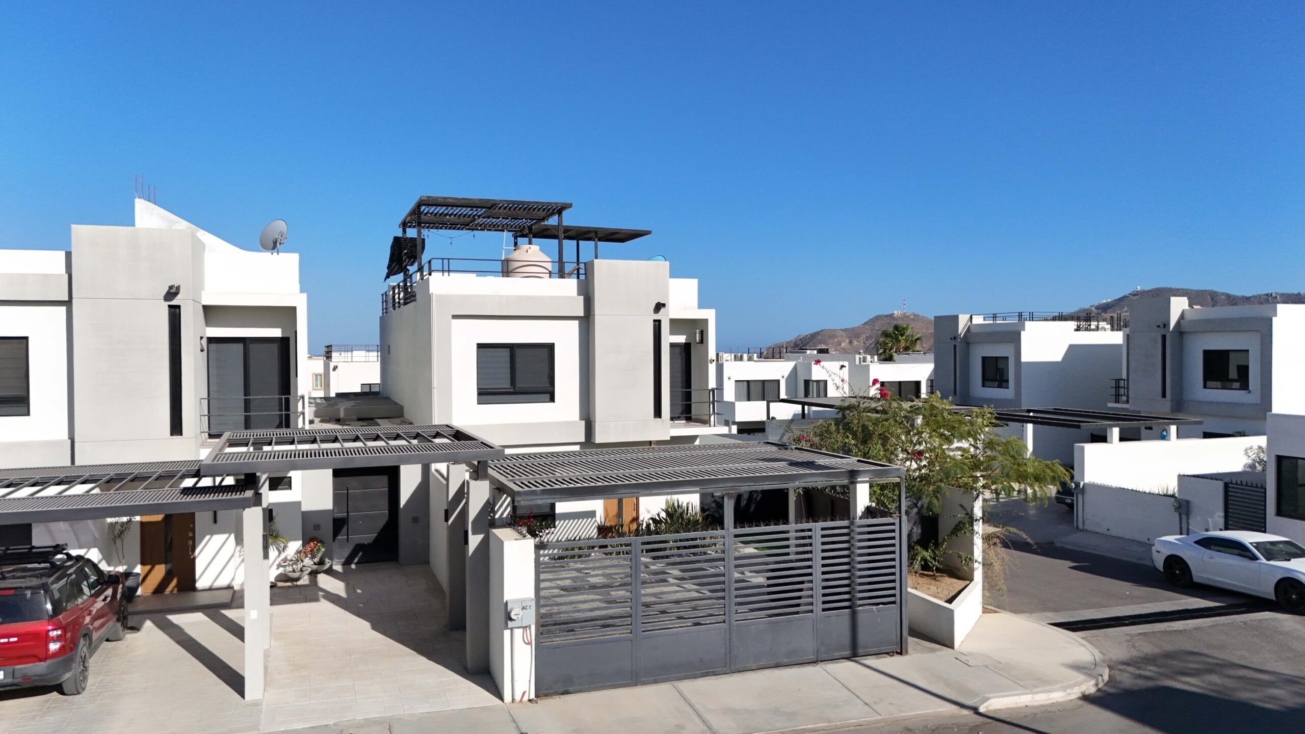 Cabo San Lucas Terranova Beautiful turnkey two-story corner home located in the gated community of Terranova Residencial. The main level offers an inviting living and dining area, a kitchen with granite countertops and pantry. Also a flex room ideal as a guest bedroom or home office.The second level features three bedrooms, including a spacious primary suite with walk-in closet, bathtub, and double vanity, plus two additional bedrooms connected by a Jack-and-Jill bathroom.Enjoy a private backyard with an 80 m² garden, swimming pool, and BBQ area, perfect for entertaining. The rooftop terrace with pergola and BBQ area offers beautiful sunset for sale