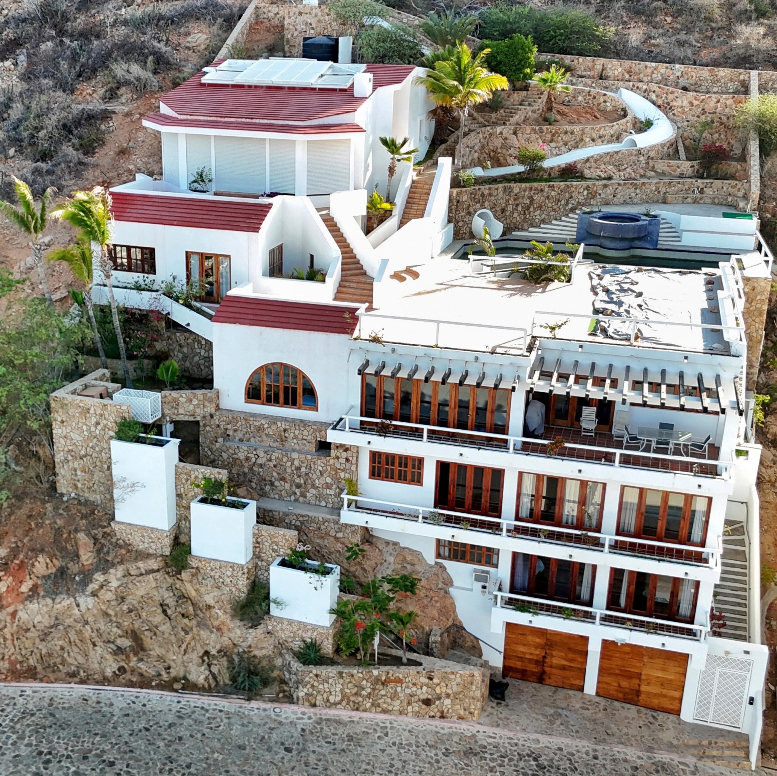 Cabo San Lucas Pedregal Csl Perched high above the marina and the Sea of Cortez, this extraordinary 10,000-square-foot estate is one of Pedregal's most iconic residences. Carved into the granite hillside, the property represents a remarkable piece of Cabo San Lucas history and offers an architectural experience unlike any other in Los Cabos.Panoramic for sale