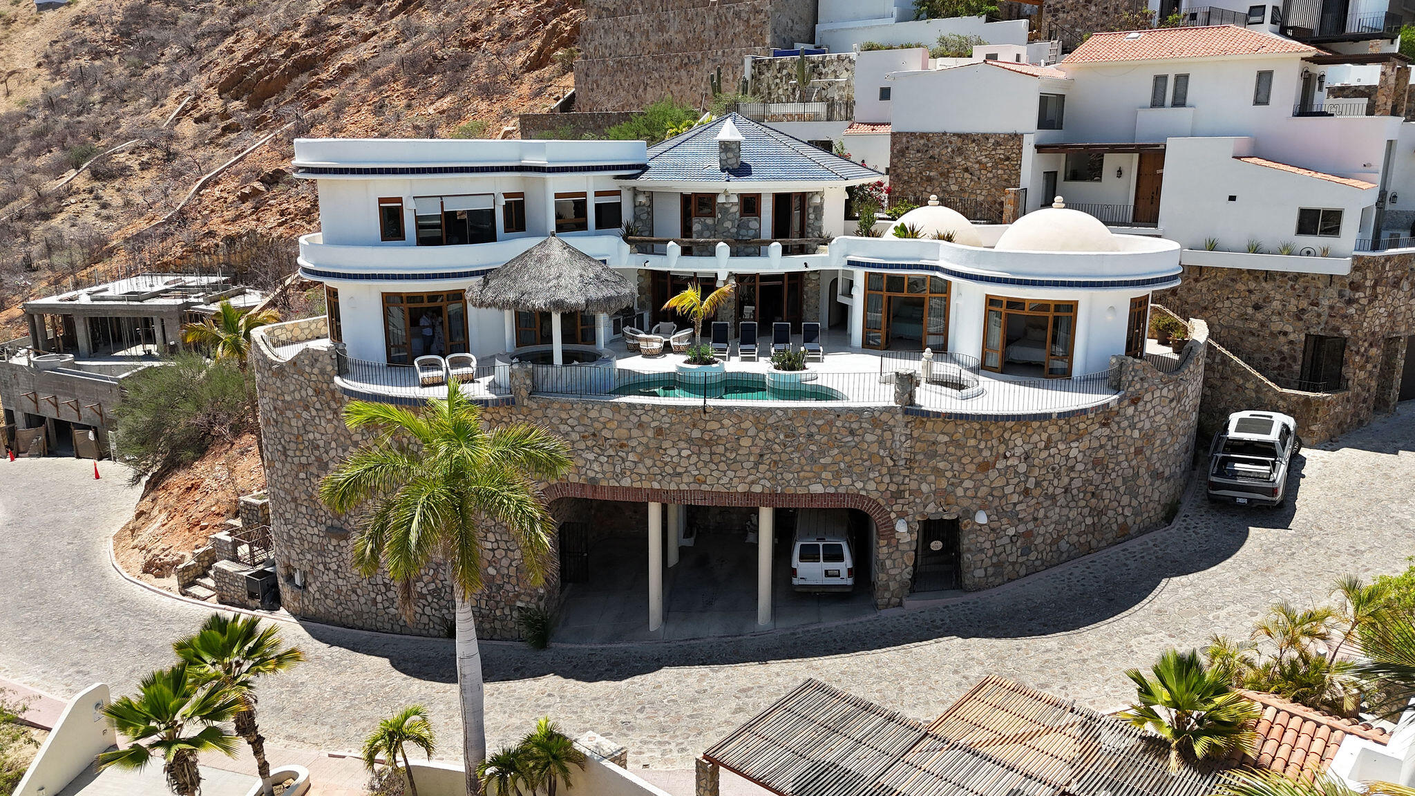 Cabo San Lucas Miramar Discover this stunning home located in the desirable Miramar area, thoughtfully designed to offer spacious living, comfort, and exceptional entertainment spaces.This beautiful two-story residence features 5 spacious bedrooms, 5 full bathrooms, and 1 half bathroom, with a modern layout that maximizes natural light and seamless indoor-outdoor living.The main level includes a fully equipped modern kitchen, open-concept living and dining areas, a convenient laundry room, and a two-car garage. Large windows and well-designed spaces create a bright and welcoming atmosphere throughout the home. The highlight of the property is its impressive rooftop entertainment area, perfect for hosting family and friends. It features a built-in BBQ grill, sink, two additional half bathrooms, a cozy fire pit, and a beautiful swimming pool, creating the ideal setting to enjoy outdoor living and breathtaking sunsets.Located in a peaceful and growing neighborhood, Miramar offers convenient access to schools, shopping centers, restaurants, beaches, and the main roads connecting all of Los Cabos. for sale